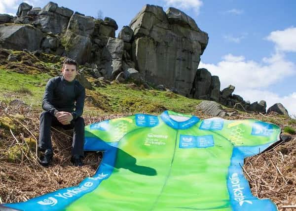 Picture by Alex Whitehead/SWpix.com - 29/04/2015 - Cycling - Tour de Yorkshire - Ilkley, Yorkshire, England - Team Sky cyclist Ben Swift is pictured with a giant Yorkshire Bank Sprinters Jersey near the Cow and Calf rocks in Ilkley Moor ahead of the inaugural Tour de Yorkshire cycling race.