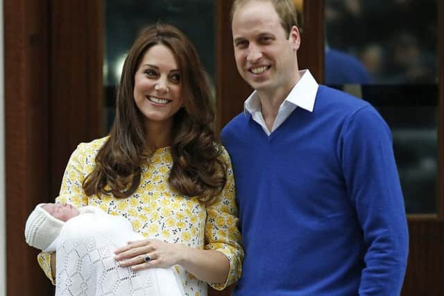 Kate and William with their baby daughter.
Photo: AP