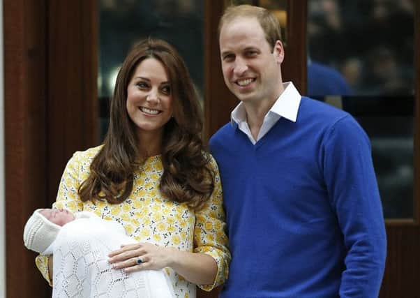 Kate and William with their baby daughter.
Photo: AP