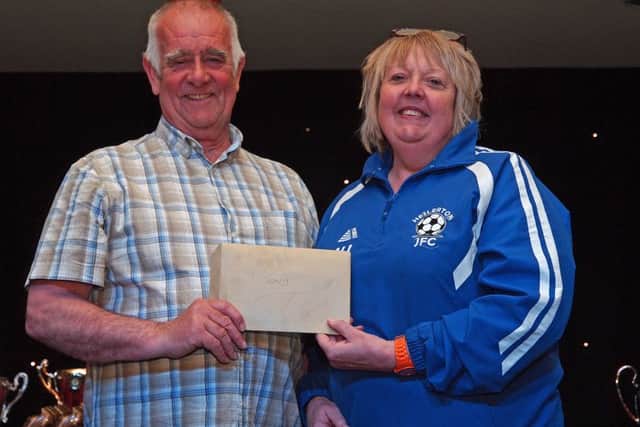 Retiring after 27 years service to the Minor Leagues Tony Groves receives a cash gift on behalf of all the league clubs