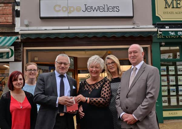 Christine Ampson is retiring from Cope Jewellers after 26 years of service, Christine is pictured recieving a gift from Andrew Cope watched by colleagues Alan Burrows, manager, Becky Daly, Amie Crooks and Margaret Young