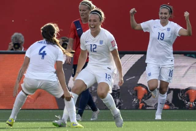 England's Lucy Bronze, centre, celebrates with teammate Fara Williams, left, as Jodie Taylor cheers on in the background in the second half of soccer action during the Round of 16 at the FIFA Women's World Cup Monday June 22, 2015 in Ottawa, Ontario, Canada. (Adrian Wyld/The Canadian Press via AP) MANDATORY CREDIT