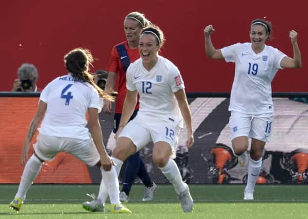 England's Lucy Bronze, centre, celebrates with teammate Fara Williams, left, as Jodie Taylor cheers on in the background in the second half of soccer action during the Round of 16 at the FIFA Women's World Cup Monday June 22, 2015 in Ottawa, Ontario, Canada. (Adrian Wyld/The Canadian Press via AP) MANDATORY CREDIT