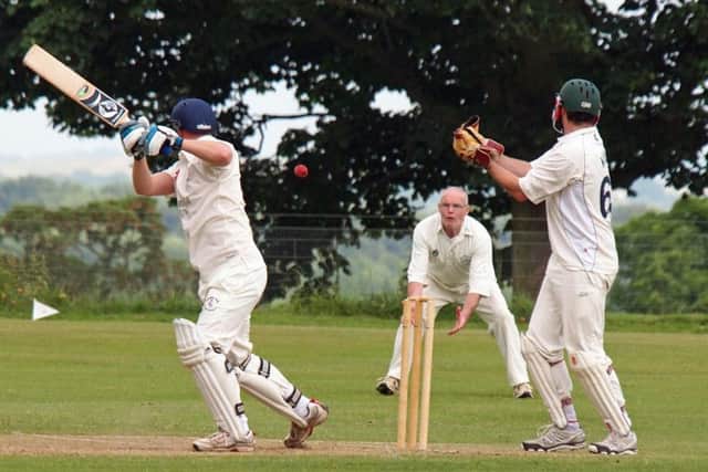 Wykeham batsman Mathew Graves plays a shot to Phil Chambers, but the veteran dropped the chance 152028b