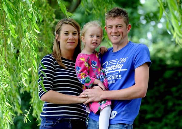 Parents Liam and Ami Duggleby with their daughter Lilly, three, months after their second daughter Minnie passed away at just 23-days-old. Picture by James Hardisty.