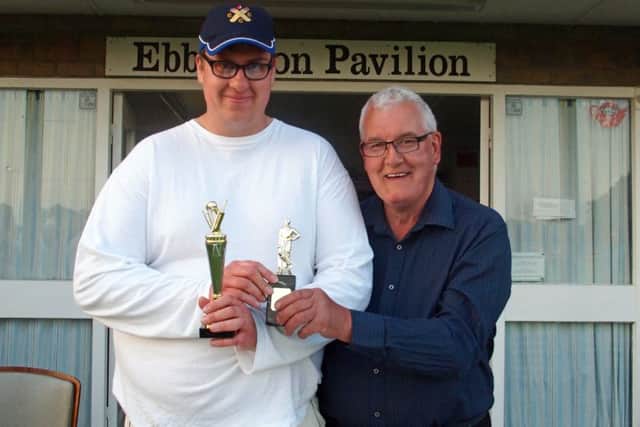 Man Of Match William Wood, left, collects his trophy from league vice president Bob Cowton, right, 152035a
