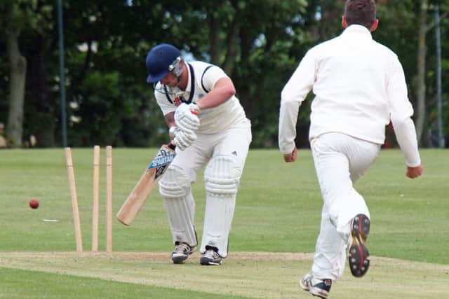 Scarborough 2nds all-rounder Charlie Roberts takes a Civil Service wicket on his way to figures of 5-34 Picture: Steve Lilly (153040g)