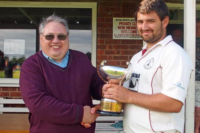 Kirkby captain James Harper recieves the Home Guard Cup from Graham Newbold. Picture: Steve Lilly (152042b)
