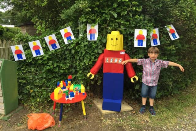 Harry Amstell with his prized scarecrow - but cruel thieves have left the six-year-old heartbroken