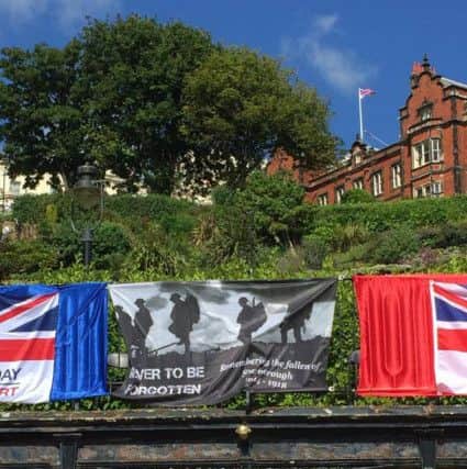 The black and white Armed Forces Day flag on Scarborough promenade before it was stolen by Katie Louth. See Ross Parry copy  RPYFLAG : A drunken lout stole a World War One Rememberance flag before posting on Facebook - it looks mint on my wall. Shameful Kevin Johnson, 48, was collared by police after his post was shared hundred of times on the social networking site, with sickened users labelling him a tool.  Johnson was arrested alongside his girlfriend Katie Louth, 25, who pleaded guilty to stealing the flag earlier this month. Louth told magistrates at Scarborough Magistrates Court, North Yorks., she would happily testify against Johnson after he initially denied the charge - blaming her for the whole incident - before leaving her in court too go down the pub.