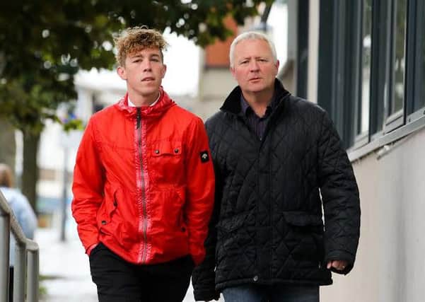 Christopher Backhouse supported by his dad Andrew in court