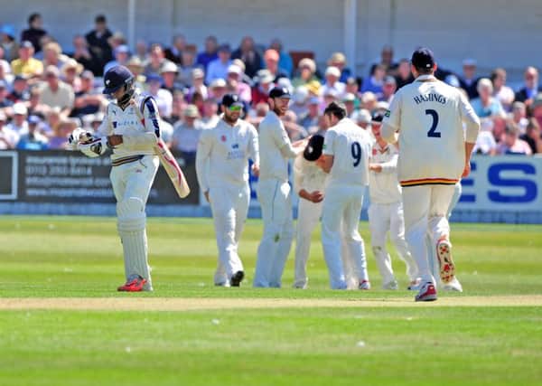 Adil Rashid is caught by Jack Burnham as Yorkshire collape in their first session on the fist day in their county championship match at North Marine Road, Scarborough against Durham. (Picture: Tony Johnson)