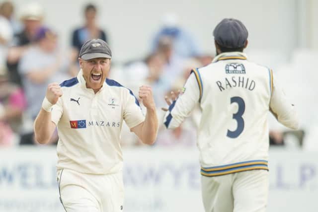 Adil Rashid rushes to congratulate Andrew Gale after the champions' captain took the catch which sealed Yorkshires win on Sunday (Picture: Allan McKenzie/SWpix.com).