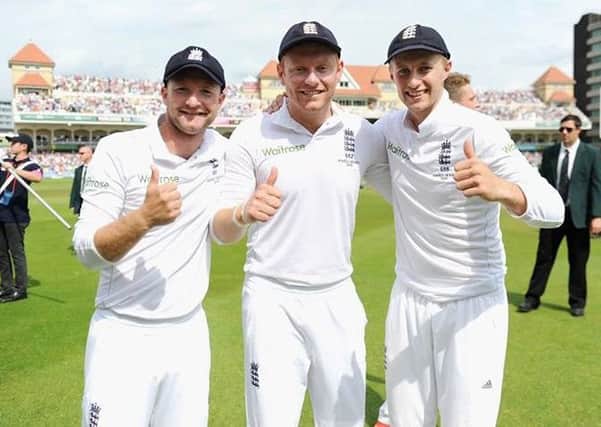 Adam Lyth celebrates with Yorkshire and England teammates Jonny Bairstow and Joe Root