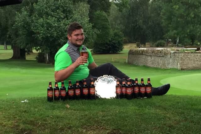 Adam Morris celebrates winning the Fullers London Pride Gold Medal at Frilford Heath GC