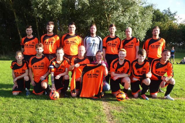 Hunmanby United  Reserves line up in their new kit  with Hayley Wedge of sponsors P.D Hire			                                      Picture: Steve Lilly