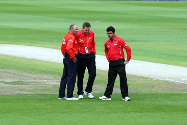 Umpire Rob Bailey, centre, with colleagues Tim Robinson, left, and Aleem Dar.