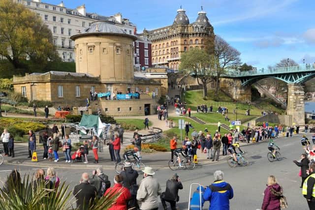 TOUR DE YORKSHIRE 2015 --- Final section through Scarborough town centre on Stage 1 of the first Tour De Yorkshire bike race. // Riders make their way under the Spa Bridge past the Rotunda Museum. Friday 1st May 2015. HARRY ATKINSON REF: