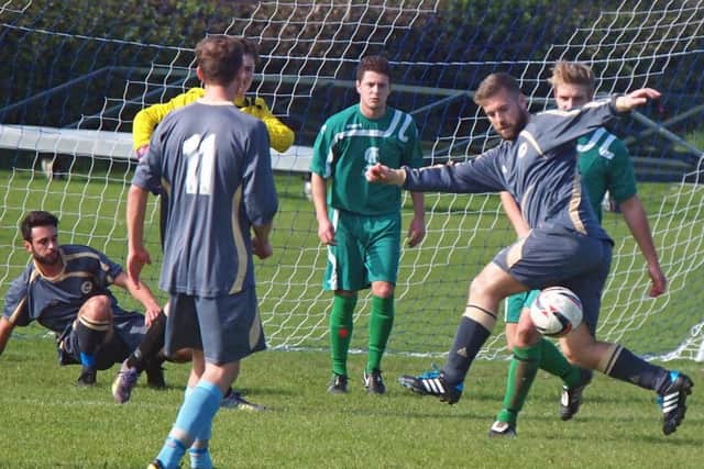 Mark Swales tries to bring the ball down during Whitby Fishermen's 1-1 draw on the road at Cayton. Picture: Steve Lilly.