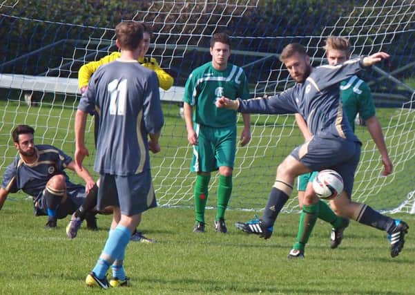 Mark Swales tries to bring the ball down during Whitby Fishermen's 1-1 draw on the road at Cayton. Picture: Steve Lilly.