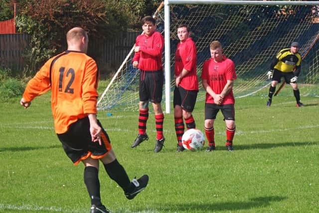 Hunmanby Utd Reserves player-manager Dave Wedge swings a ball into the box during their 5-4 defeat against Filey Town 3rds. Picture: Steve Lilly