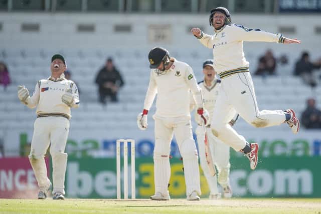 Yorkshire captain Andrew Gale, right, celebrates along with Johnny Bairstow, left, dismissal of Chris Liddle, meaning the County Champions finished the 2015 season on a winning note at Headingley yesterday. Picture: SWPIX.COM