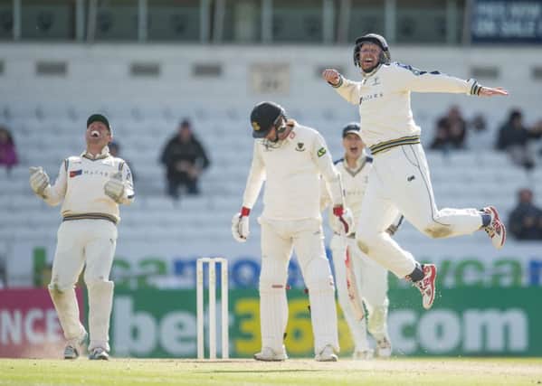 Yorkshire captain Andrew Gale, right, celebrates along with Johnny Bairstow, left, dismissal of Chris Liddle, meaning the County Champions finished the 2015 season on a winning note at Headingley yesterday. Picture: SWPIX.COM