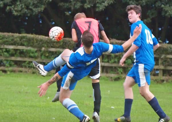 Commercial Skipper Josh Dolan attempts to stop a goalbound Sam Braodbent.It Is It Is Rovers V Commercial @Olivers Mount 152101g