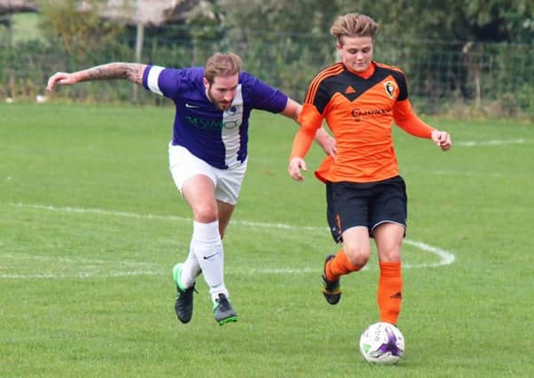 Edgehill's Jackson Jowett runs at the Unicorn defence during their eight-goal thriller at Staxton. Pictures: Steve Lilly