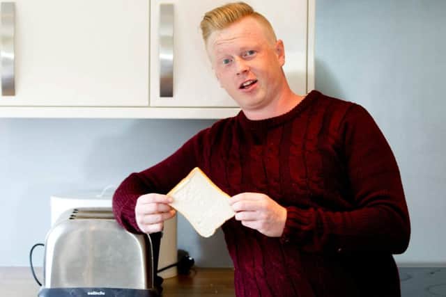 Master thrower Matt Fleet doing his most well known trick "Fancy some Toast" where is throws bread over his shoulder into a toaster. Picture: SWNS