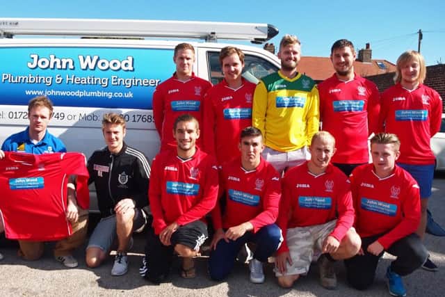 Newlands manager Ben Luntley receives their new kit from sponsors John Wood Plumbing & Heating. Picture: Steve Lilly