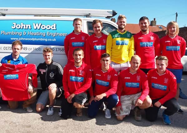 Newlands manager Ben Luntley receives their new kit from sponsors John Wood Plumbing & Heating. Picture: Steve Lilly