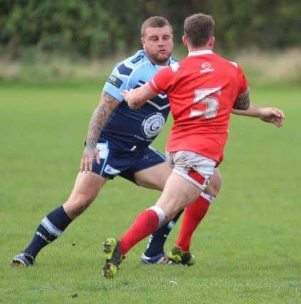 Dave Douthwaite in action for the Yorkshire Lionhearts, above, blue kit
