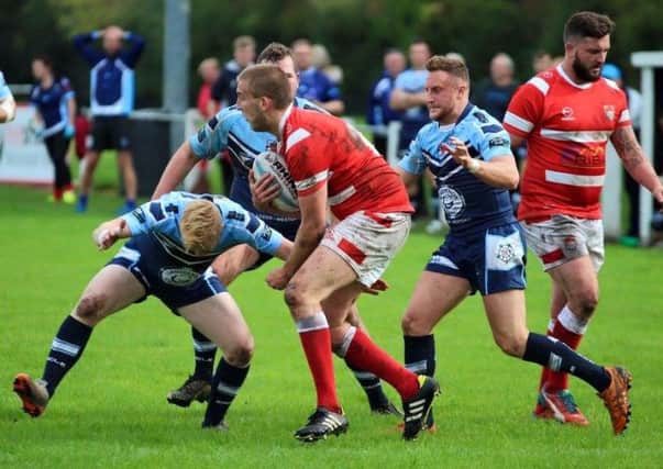 Scarborough Pirates pair Harry Sleep, above right, blue kit, and Dave Douthwaite, below, were part of the Yorkshire Lionhearts side for the Roses clash