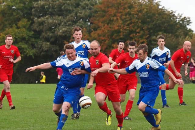Edgehill res duo Alistair Jenning's & Thomas Scales muscle Tom Garbutt off the ball 152118d.Edgehill Res v Norton & Malton Res FA JNR Cup@Olivers Mount Sat 17-10-15
