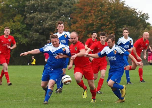 Edgehill res duo Alistair Jenning's & Thomas Scales muscle Tom Garbutt off the ball 152118d.Edgehill Res v Norton & Malton Res FA JNR Cup@Olivers Mount Sat 17-10-15