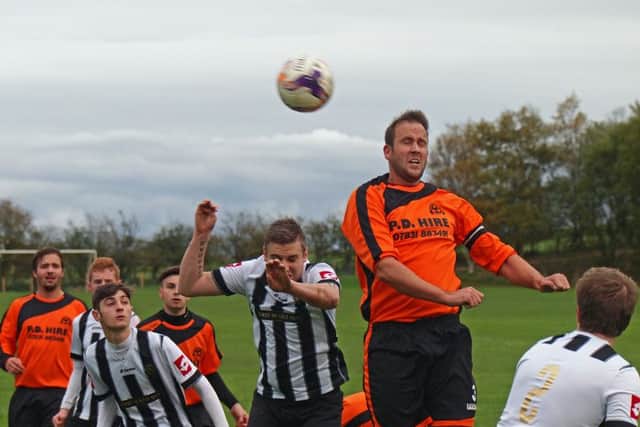 Hunmanby skipper Steve Pratt rises above the pack to win a header in his side's 6-2 win against Sleights Reserves. Picture: Steve Lilly