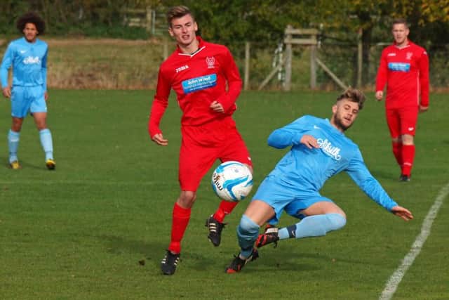 Trafalgar's Liam Vasey challenges with a Newlands man. Picture: Steve Lilly