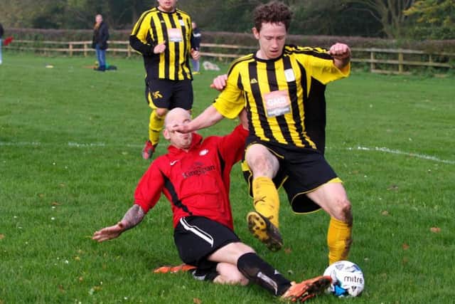 James Seymour gets tackled by a Sherburn opponent. Photo by: Graeme Farrah. 31.10.2015