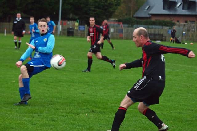 Ray Thorpe fire a shot at the Ayton goal, Jake Adams looks on. 152127.Ayton v West Pier Res, Scarborough News Saturday League Division Two 14-11-15@Wilsons Lane.
