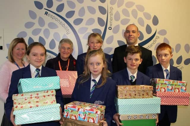 Ebor Academy Filey students and staff pictured with some special Christmas gifts for the children of Azerbaijan.