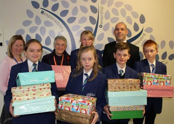 Ebor Academy Filey students and staff pictured with some special Christmas gifts for the children of Azerbaijan.