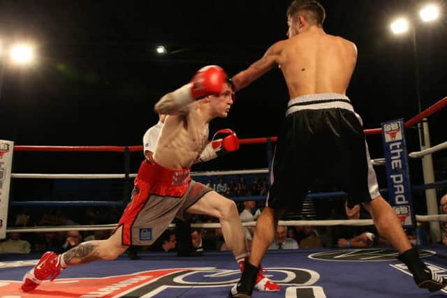 Shaun Ireland throws a right hand against Ryan Hanson. Picture: Lesley Pickersgill.