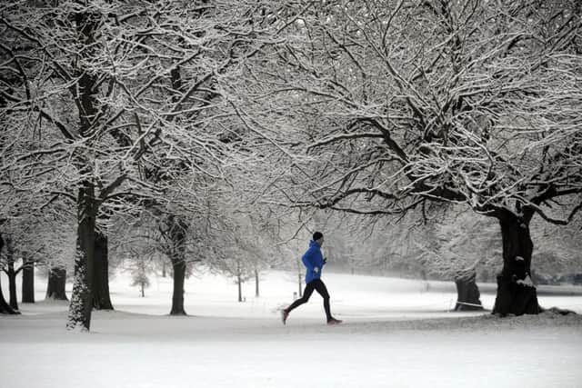 A runner runs through the snow at the Yorkshire Sculpture Park, near Wakefield. (Picture by Simon Hulme)