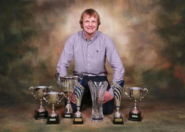 Ivan Lintin shows off some of the trophies he won at the Auto 66 Club presentation night            Picture by Alan Horner