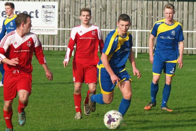 Filey Town, blue kit, were beaten in their FA Harbour Cup clash at Kirkbymoorside. Picture: Steve Lilly