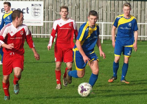 Filey Town, blue kit, were beaten in their FA Harbour Cup clash at Kirkbymoorside. Picture: Steve Lilly