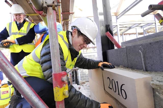 Building work at Scarborough Lifeboat Station  continues .The laying of the 2016 stone commences with  Oscar Hartley  laying the stone .pic Richard Ponter . 160505e