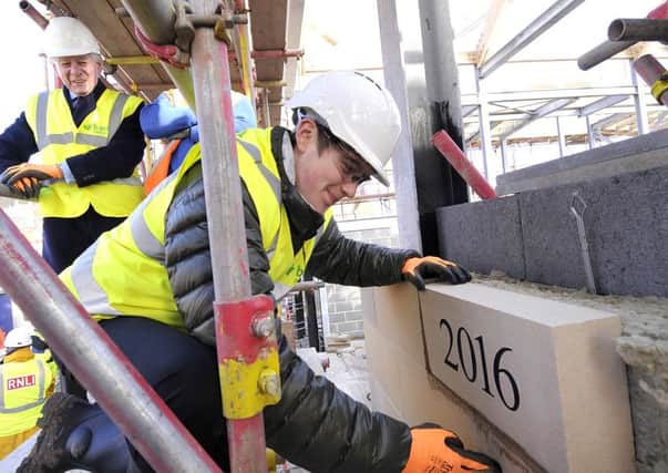 Building work at Scarborough Lifeboat Station  continues .The laying of the 2016 stone commences with  Oscar Hartley  laying the stone .pic Richard Ponter . 160505e
