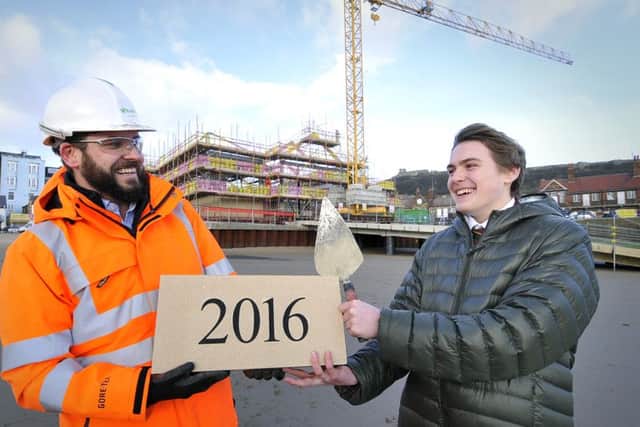Building work at Scarborough Lifeboat Station  continues .The laying of the 2016 stone commences with Richard Clifton of Bam - Nutall and Oscar Hartley ready to lay the stone. pic Richard Ponter . 160505a